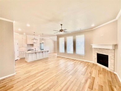 Unfurnished living room with ornamental molding, l