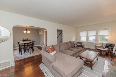 Refinished hardwood floors greet you in the large living room.