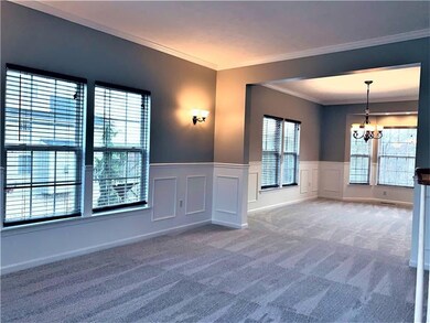The 15x12 living room has crown molding,sconce lig