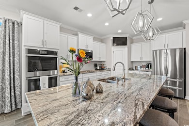 Kitchen with sink, light hardwood / wood-style flo