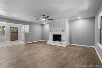 Large open living area with a brick fireplace!