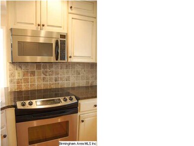 Close up of kitchen appliances and tile backsplash