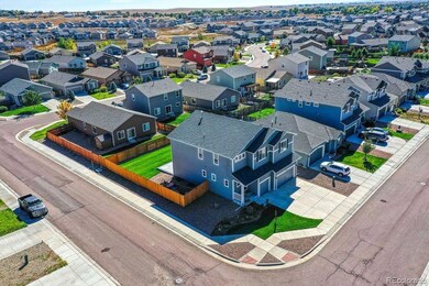 Aerial view of side yard and home