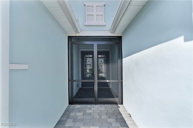 Property entrance with french doors