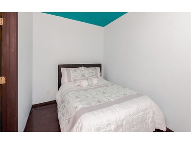 Bedroom with queen size bed.