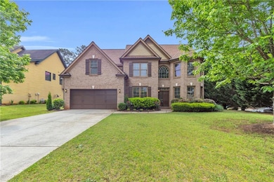 Traditional home featuring a front lawn, driveway,