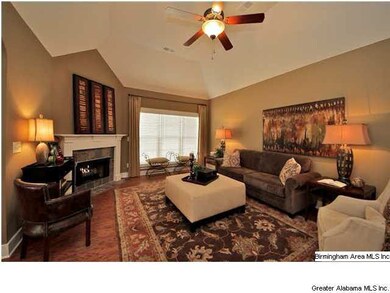 Beautiful fireplace and triple windows to let the 
