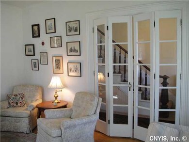Living Room French doors off front hallway open to