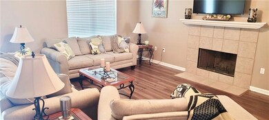 Spacious Living Room with Ceiling Fan, Wood Firepl