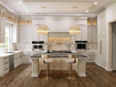 Kitchen with glass insert cabinets, dark stone countertops, decorative backsplash, a breakfast bar area, and recessed lighting