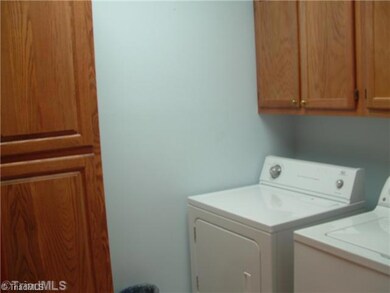 Laundry Room. The laundry room is located just outside of the kitchen.  Lots of cabinetry for storage.