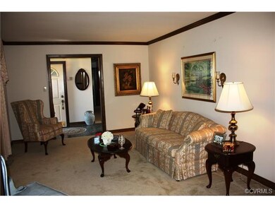 Formal living room with crown moulding.