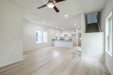 Unfurnished living room featuring light wood-type 