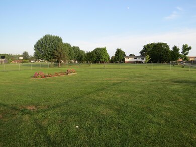 Large fenced front yard