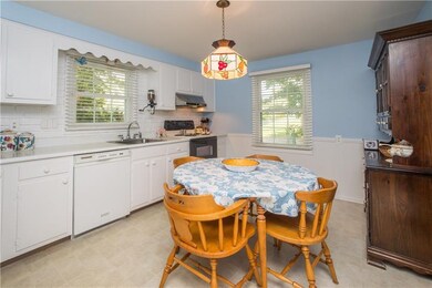 The eat-in kitchen is equipped with dishwasher, el