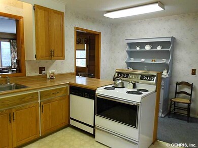 Kitchen. The remodeled oak kitchen has lots of cup