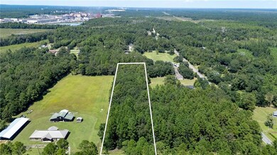 View of property location with property boundaries highlighted and a nearby body of water