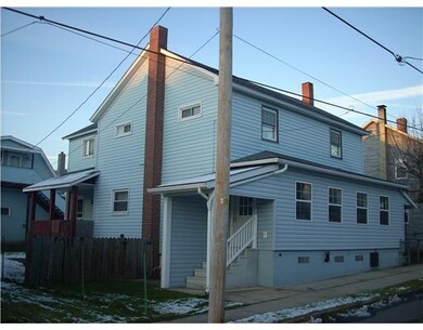Exterior Front. Front & side view of duplex
