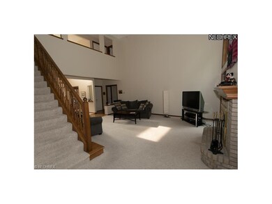 A staircase leads up from the great room to 4 bedr