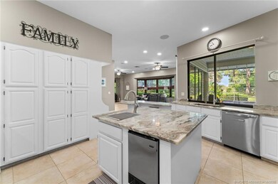 Kitchen island has an icemaker, sink, and garbage