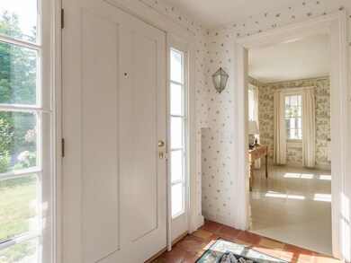 The front door opens into a foyer...