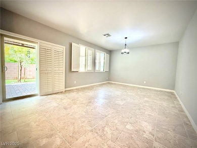 Unfurnished room featuring baseboards and visible