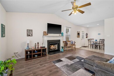 Living room has gas logs