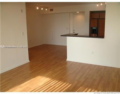 Views from the living room into the open kitchen and formal dinning.