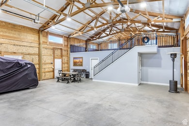 Garage with baseboards and a garage door opener