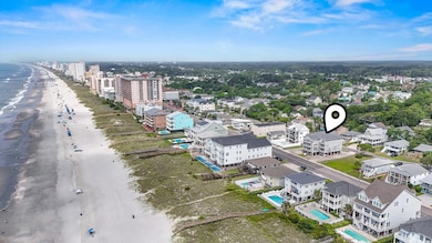 Aerial view of expansive coastline and a pool area