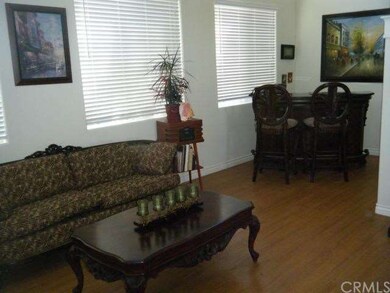 Living room with laminate flooring.