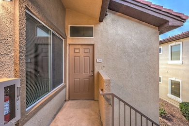 View of exterior entry featuring stucco siding