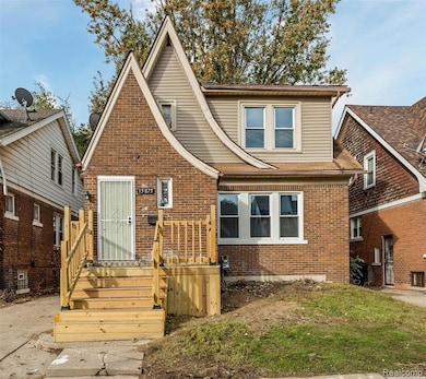 View of front of house featuring brick siding