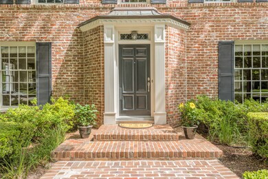 If you're attentive, you'll notice beautiful copper roof accents over the front and side doors.  This home is filled with delightful detailed elements.