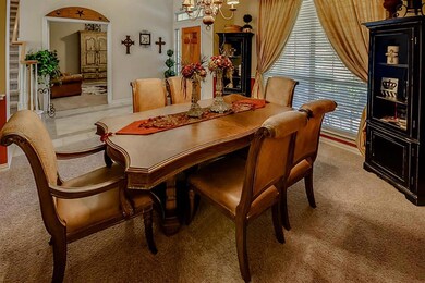 Beautiful dining room right off the entry and across from the study.