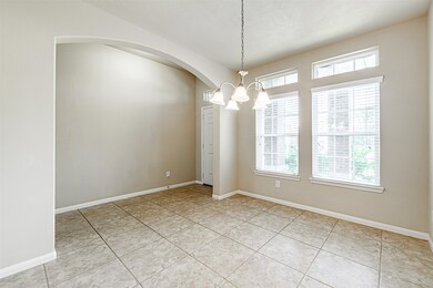 This is another view of the immaculate dining retreat with beautiful gray and white walls and woodwork.  The five globe chandelier will illuminate your dining room table surrounded by your guests while enjoying each other’s company and your delicious holiday meal.