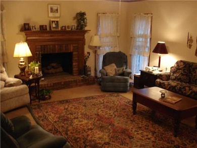 The Great Room offers crown molding, brick firepla