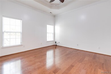 Spare room featuring ornamental molding, light har
