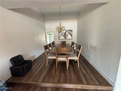Dining area with baseboards, a notable chandelier,