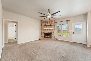This cozy living room features a charming brick fi