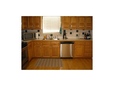 Large kitchen with hardwood floors and tons of cab