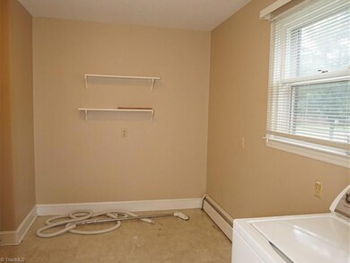Huge laundry room and mud room with central vacuum system.