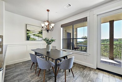 Dining space featuring a decorative wall, visible
