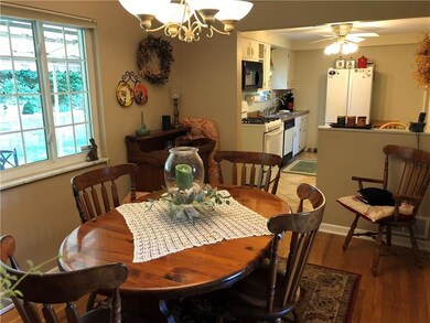 Neutral colors and gleaming hardwoods make this ho