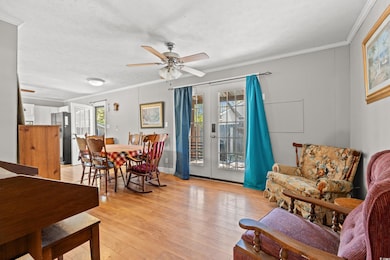 Dining room with light wood-style flooring, ceilin