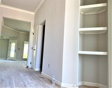 Niche in entry. Hardwood flooring in entry, office