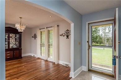 Front entry and Dining room with curved arches