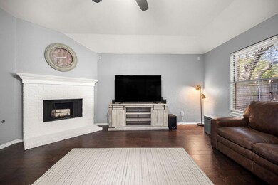 Living room with ceiling fan, vaulted ceiling, dar