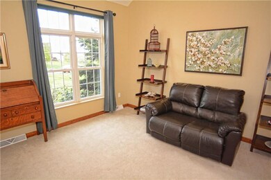 The formal living room is bright and spacious with