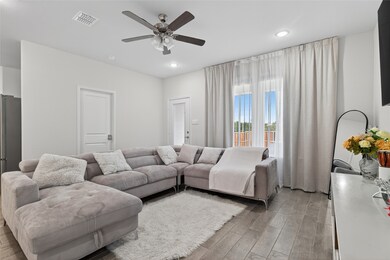 Living area with ceiling fan, and recessed lighting